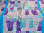 nine patch pastel quilt